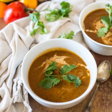 two bowls of soup with ingredients